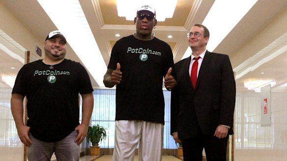 Former basketballer Dennis Rodman (centre) arrives in the North Korean capital Pyongyang on Tuesday.