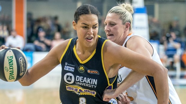Liz Cambage makes a path to the basket against Fire's Suzi Batkovic.