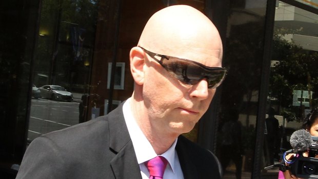 Robert Zitzelsperger leaves the Downing Center District Court in Sydney after avoiding jail over child pornography charges.