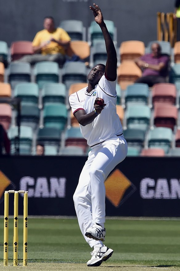 Jason Holder sends down a delivery in the first Test.