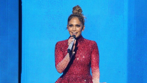 Hostess with the mostess: Jennifer Lopez brought the house down at the 2015 American Music Awards in this Swarovski embellished ombre Michael Cinco piece that she accessorised with glittering microphone. 