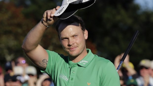 Danny Willett waves to the gallery after finishing his final round.