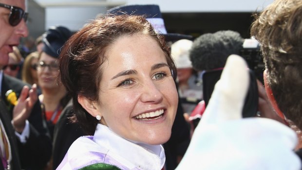 Michelle Payne celebrates after riding Prince of Penzance to win the 2015 Melbourne Cup