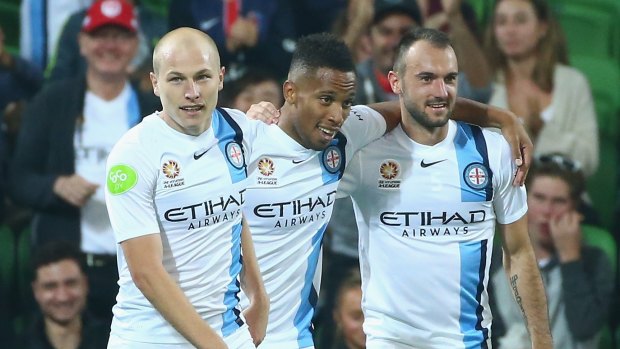 Harry Novillo celebrates with Aaron Mooy and Ivan Franjic