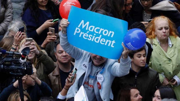 Parisians react Emmanuel Macron react the win.