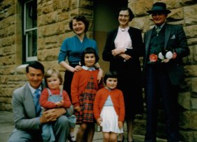 All together then: Julie Bishop as a child in the late 1950s, being held by her father, Douglas. Her mother has her hands on sister MaryLou, while sister Patricia stands in front of her grandparents Hilda and William. 
