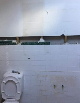 The bathroom wall where the letter was found.