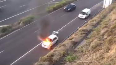 The car on fire on the Eastern Freeway.