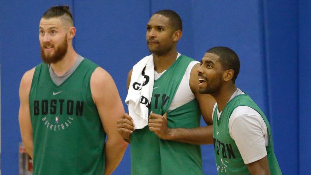 Aron Baynes (left) with Celtics teammates Al Horford and Kyrie Irving.