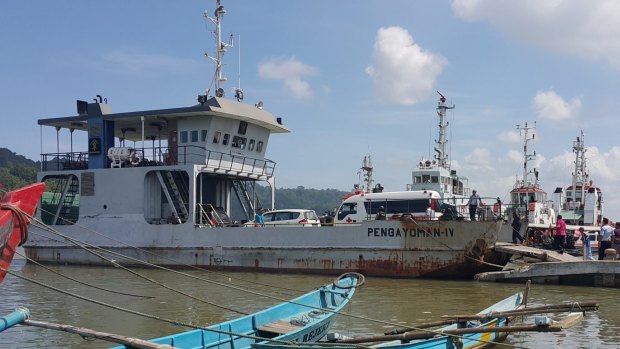 The ambulance transporting Zulfiqar Ali to Nusakambangan boards a ferry at Cilacap's port. 