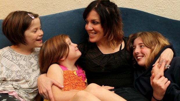 No warnings: Stroke victim Amy Walker with her daughters Eve, Milly and Ada.