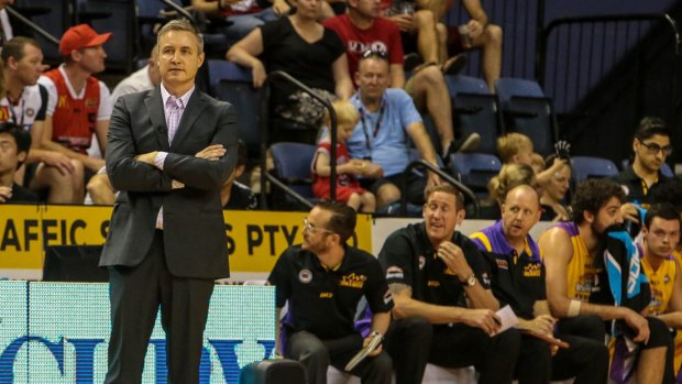 Loss in Wollongong: Damian Cotter looks bemused during the Sydney Kings' loss to Illawarra. His replacement, Joe Connelly, is seated on the bench in between fellow assistant coach Ben Knight and centre Julian Khazzouh.