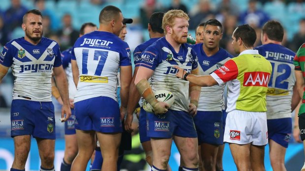 Downward spiral: James Graham is placed on report during the Bulldogs' loss to South Sydney.