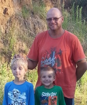 Steven Van Lonkhuyzen and his sons after being found.