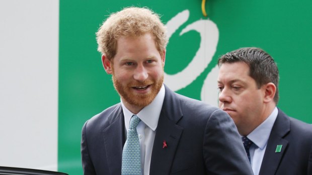 Able to keep beer chilled ... Prince Harry received two new stubby holders, a beach towel and a 'crocheted poppy' on his Australian visit.