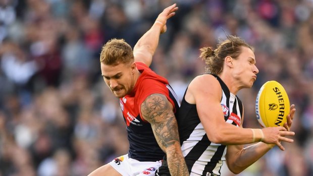 Sloppy: Tom Langdon paid a price for bad disposal against Melbourne.