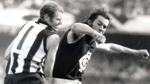 Carlton's Brent Crosswell bumps Collingwood's Terry Waters during the 1970 grand final.
