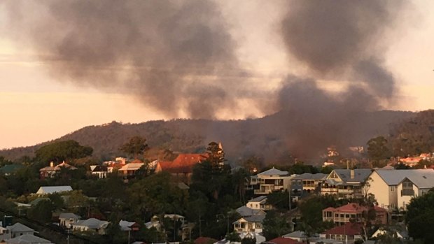 The fire sent smoke across the city as Brisbane awoke on Sunday morning.