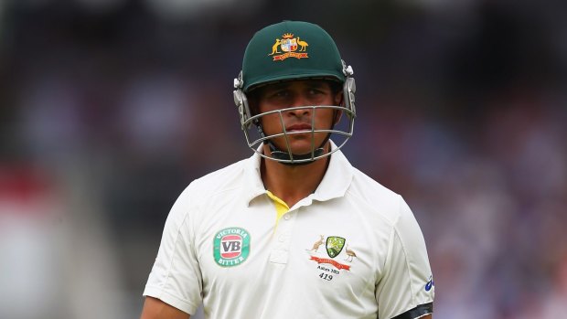 Prominent alcohol sponsorship ... Australian cricketer Usman Khawaja walks back to the dressing shed after being dismissed at Old Trafford in Manchester, England in 2013.