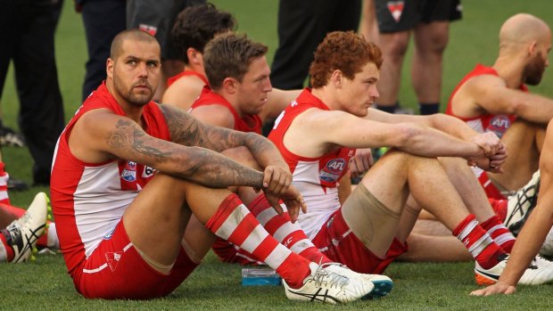 The Sydney Swans look dejected following the 2016 AFL Grand Final match.