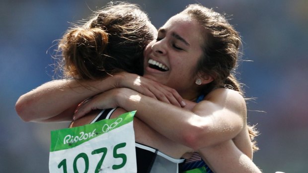 Respect: Abbey D'Agostino, right, hugs Nikki Hamblin. 