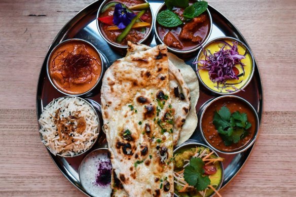 The vibrant thali tray of curries is just one course of the tasting menu. 