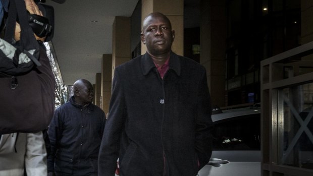 Joseph Tito Manyang, the father of the children, outside Melbourne Magistrates Court.