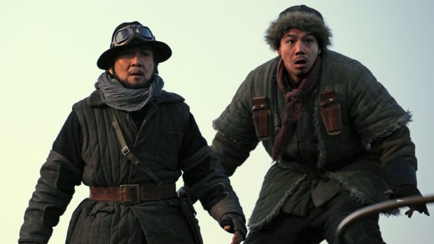 Jackie Chan (left) and Alan Ng in the new action comedy <i>Railroad Tigers</I>.