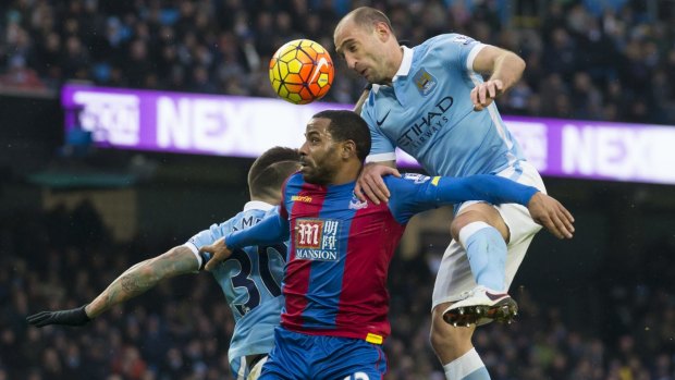 Manchester City's Pablo Zabaleta and Crystal Palace's Jason Puncheon contest the ball.