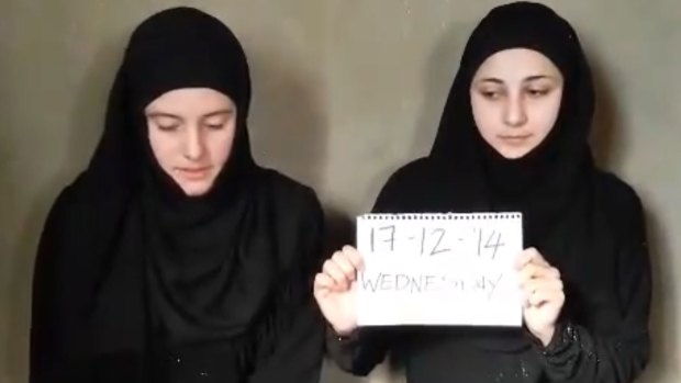 Vanessa Marzullo and Greta Ramelli wearing black dresses and headscarves in a jihadist video.
