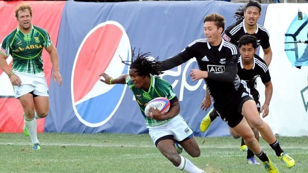Team South Africa tries to break-away from Team New Zealand during the USA Sevens Rugby Tournament in Las Vegas.