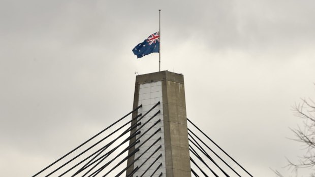 Flags at half-mast on Sydney's Anzac Bridge.