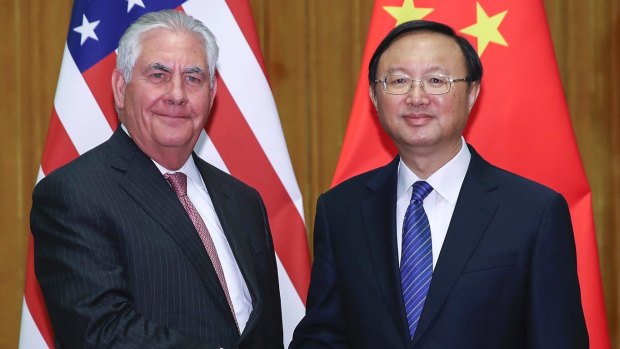 US Secretary of State Rex Tillerson shakes hands with China's State Councilor Yang Jiechi during a meeting in Beijing.