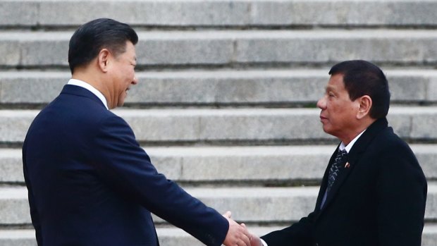 President of the Philippines Rodrigo Duterte and Chinese President Xi Jinping shake hands as they attend a welcoming ceremony in Beijing.