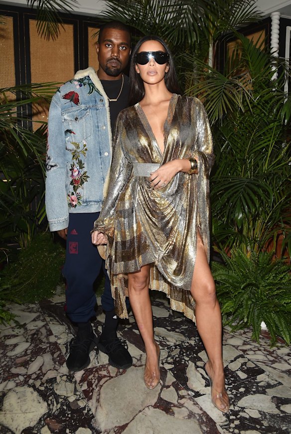 Kanye West with wife Kim Kardashian West at Paris Fashion Week in September, just a few days before she was robbed at gunpoint. 