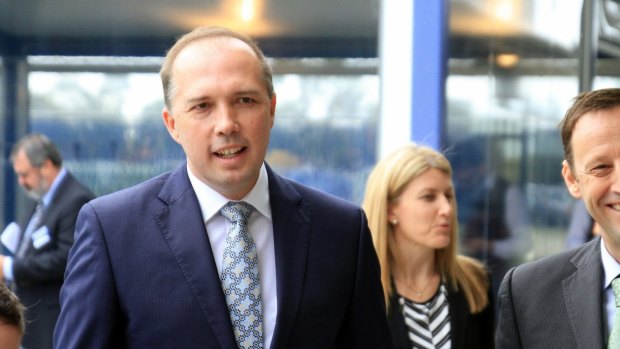 Immigration Minister Peter Dutton ducked one shoe thrown at him and caught another on Sunday morning.