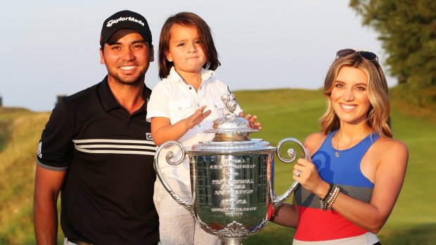 Champion performance: Jason Day with his wife Ellie and son Dash. 