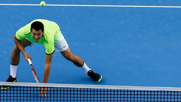Tomic on court in the China Open where he played "very sore".