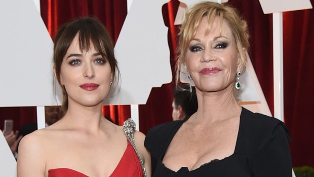 Cranky: Dakota Johnson and her mother, Melanie Griffith, before things got frosty at the Academy Awards.
