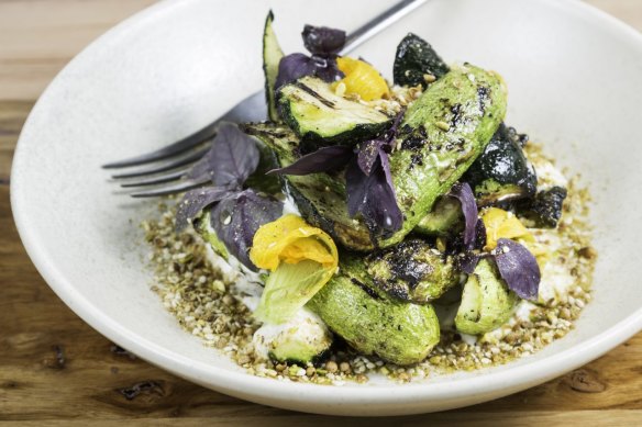 Char-grilled zucchini with goat's curd and dukkah.