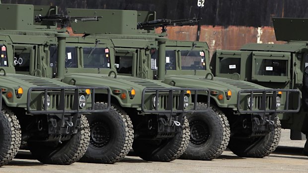 En route to the Syrian border: US military vehicles unloaded from a ship at the port in Beirut on Sunday.