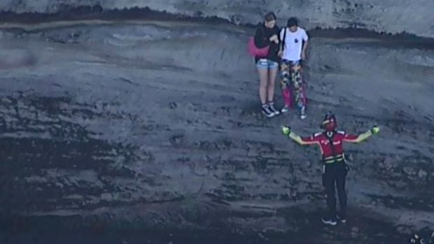 Two girls have been winched to safety from the rocks at North Head, near Manly. 