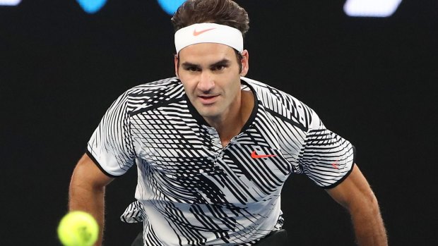 Roger Federer chases down another ball.