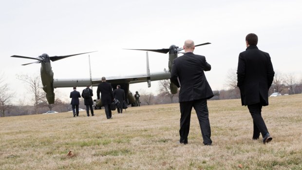 Legislators and officials board a V-22 Osprey at Fort McNair, Washington,  to travel to Dover Air Force Base in Delaware and  meet the family of a Navy SEAL killed during a raid in Yemen.  A similar aircraft used in the raid was destroyed after a 'hard landing'.