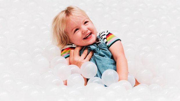 A child plays in the 1.1 million polyethylene balls which make up 'The Beach'.
