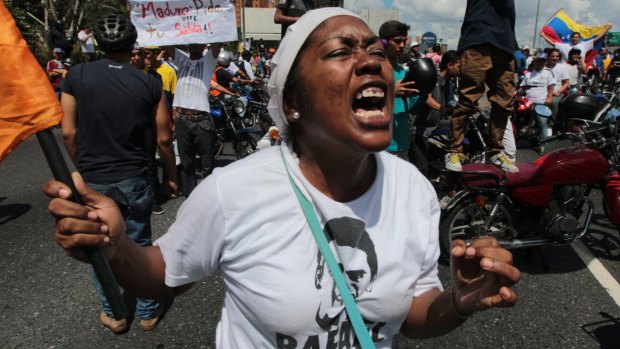 A demonstrator shouts insults against Venezuela's President Nicolas Maduro during a protest in Caracas.