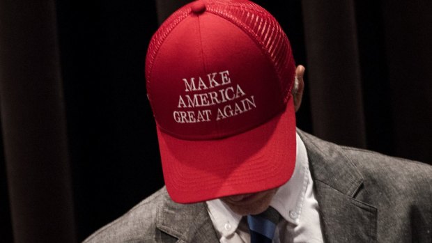An attendee wears a hat reading "Make America Great Again" before a campaign event at Youngstown State University in Youngstown, Ohio.