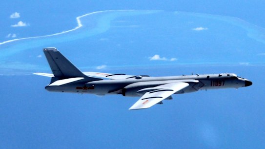 A Chinese H-6K bomber patrols the islands and reefs in the South China Sea. 