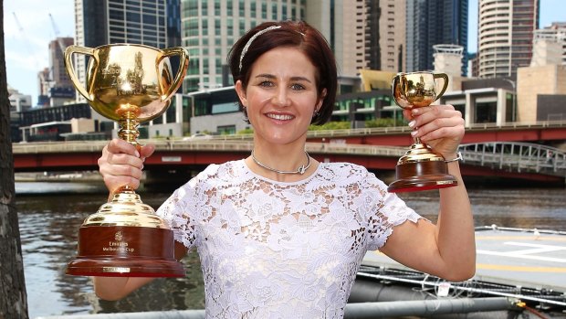 Michelle Payne poses with the Melbourne Cup.