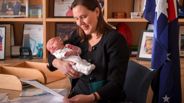 Kelly O'Dwyer in her office with her newborn son.